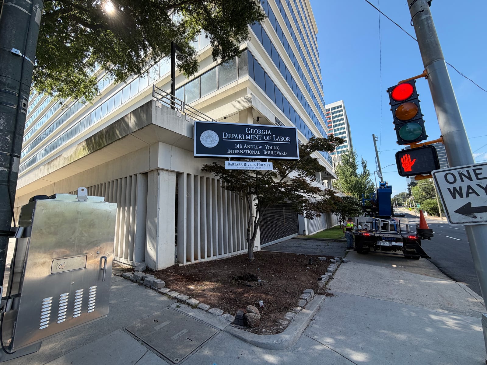 Signs and More crew installing the new Georgia Department of Labor wall sign in Atlanta